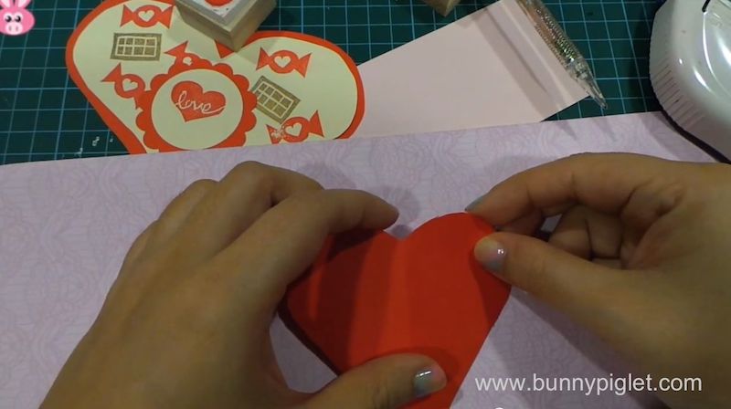 stick red heart on the card