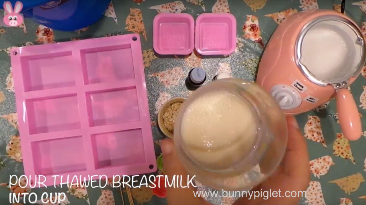 pour breast milk into cup